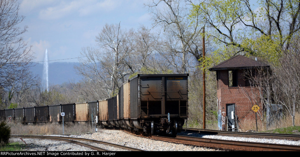 CSX 304819 brings up the rear of the train of empties heading west.